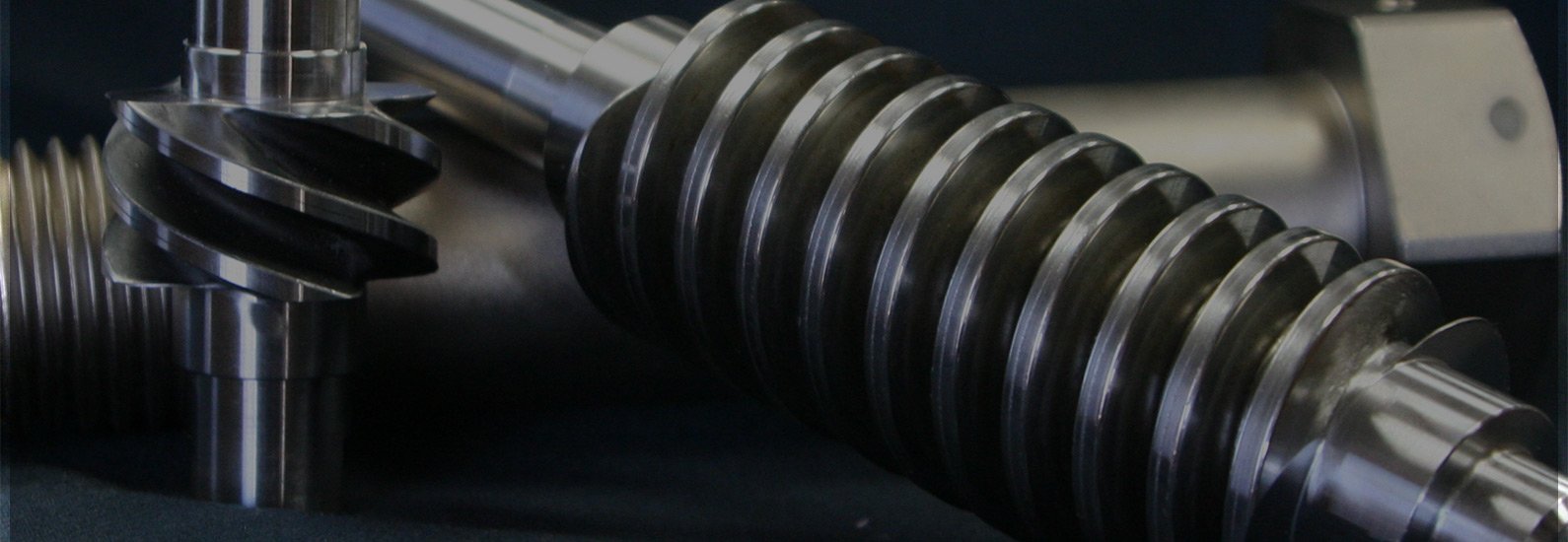 Close-up of three bolts with rolled threads