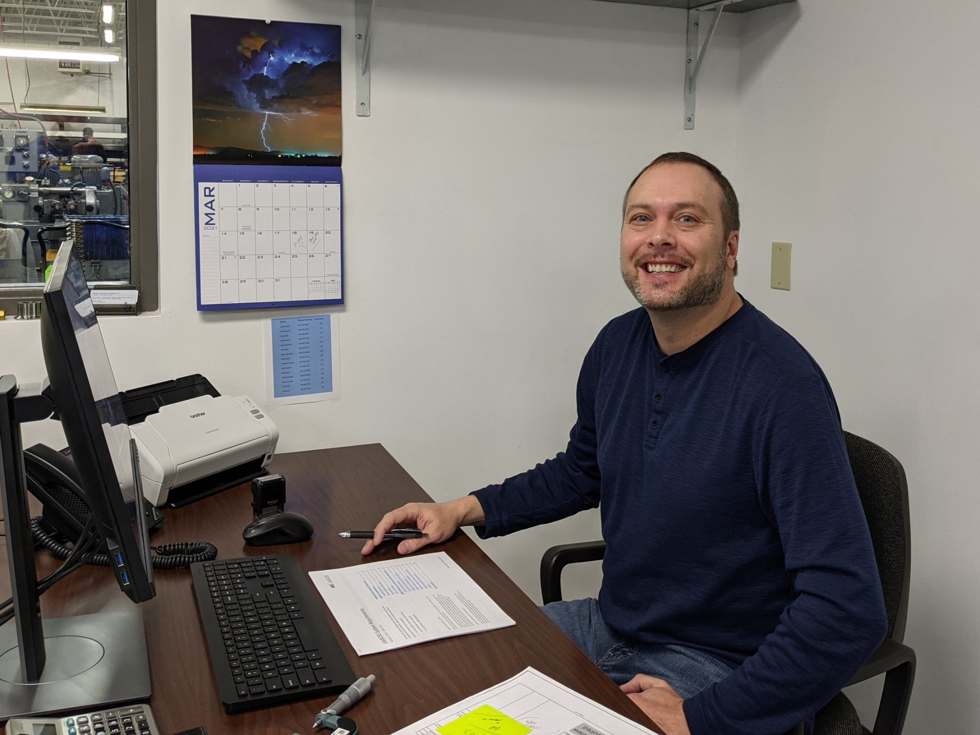 Steven Luedke sitting at his desk